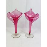 A pair of cranberry glass 'preacher in the pulpit' glass vases