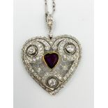 1920's ruby and diamond heart shaped pendant on chain