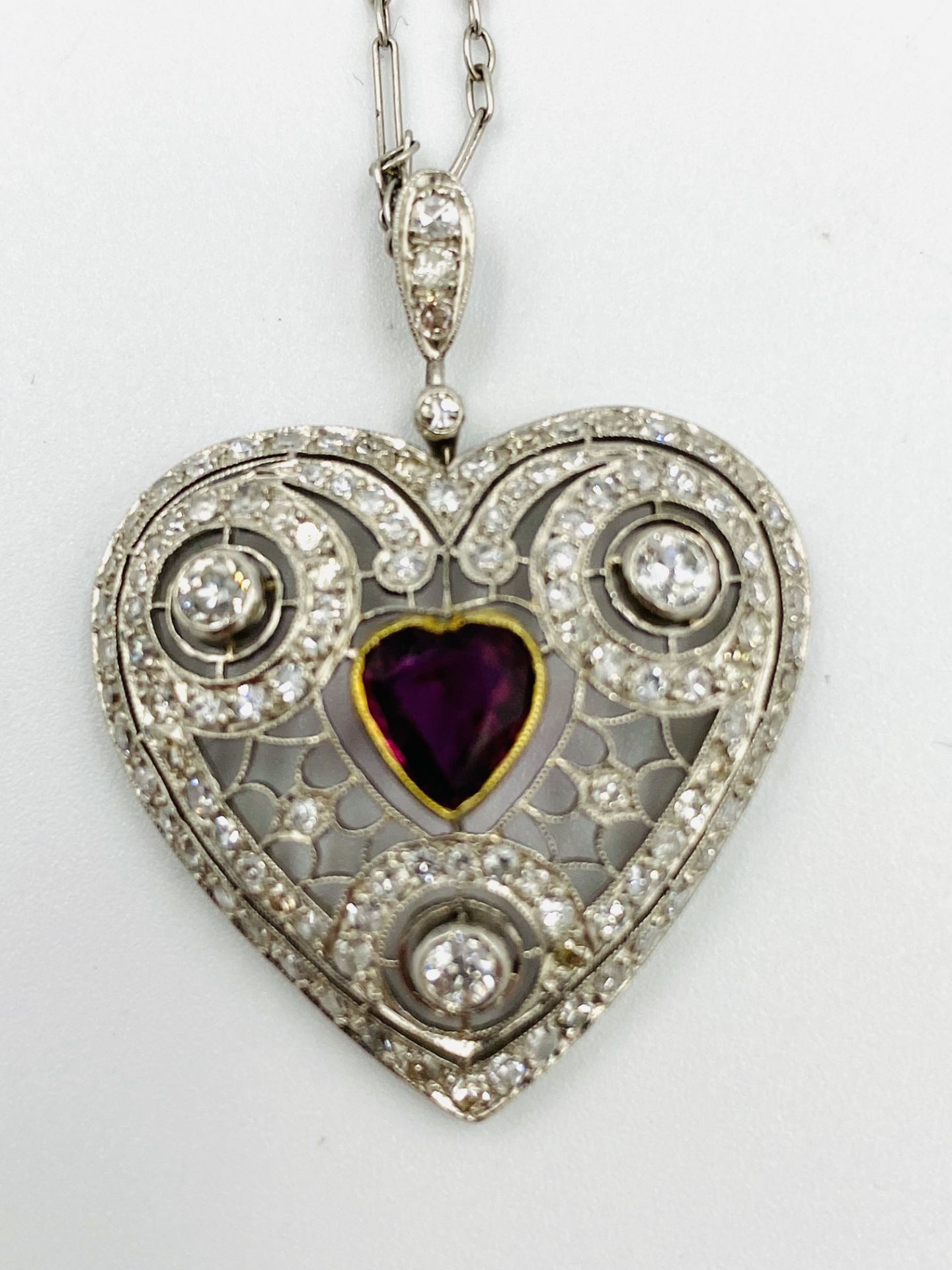 1920's ruby and diamond heart shaped pendant on chain
