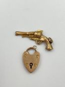 9ct gold heart shaped charm together with a yellow metal charm