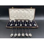 Twelve silver coffee bean spoons together with six coffee bean spoons