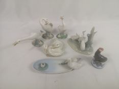 Three Lladro figures, two Nao figures and a trinket dish