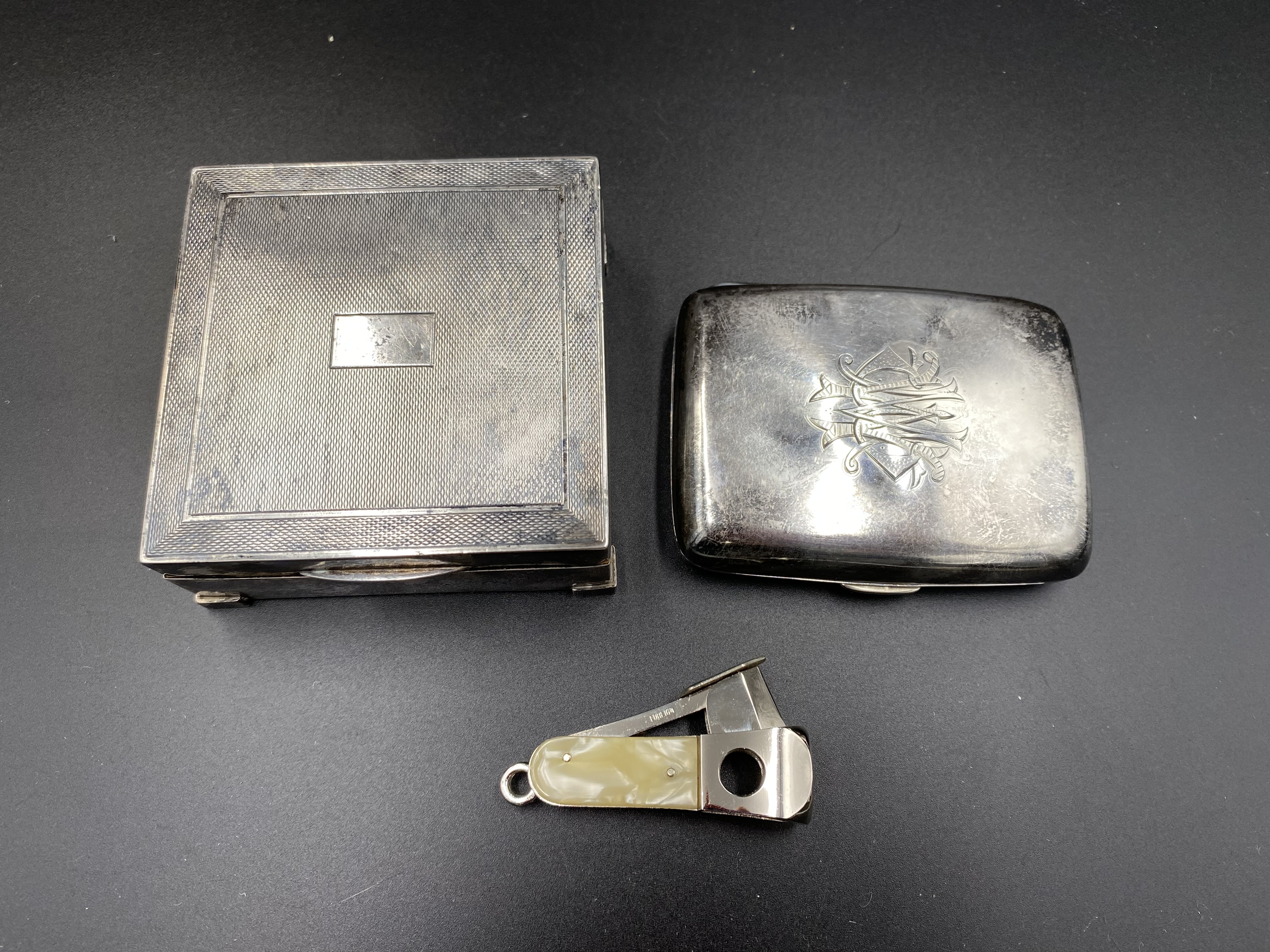 Silver cigarette box and cigarette case together with a cigar cutter