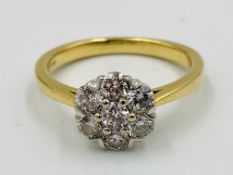 18ct gold and diamond cluster ring set with seven diamonds