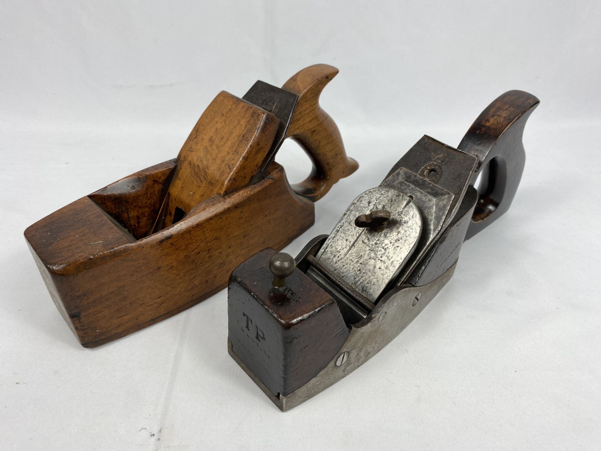 Two wood planes, marked W.M. Tyler