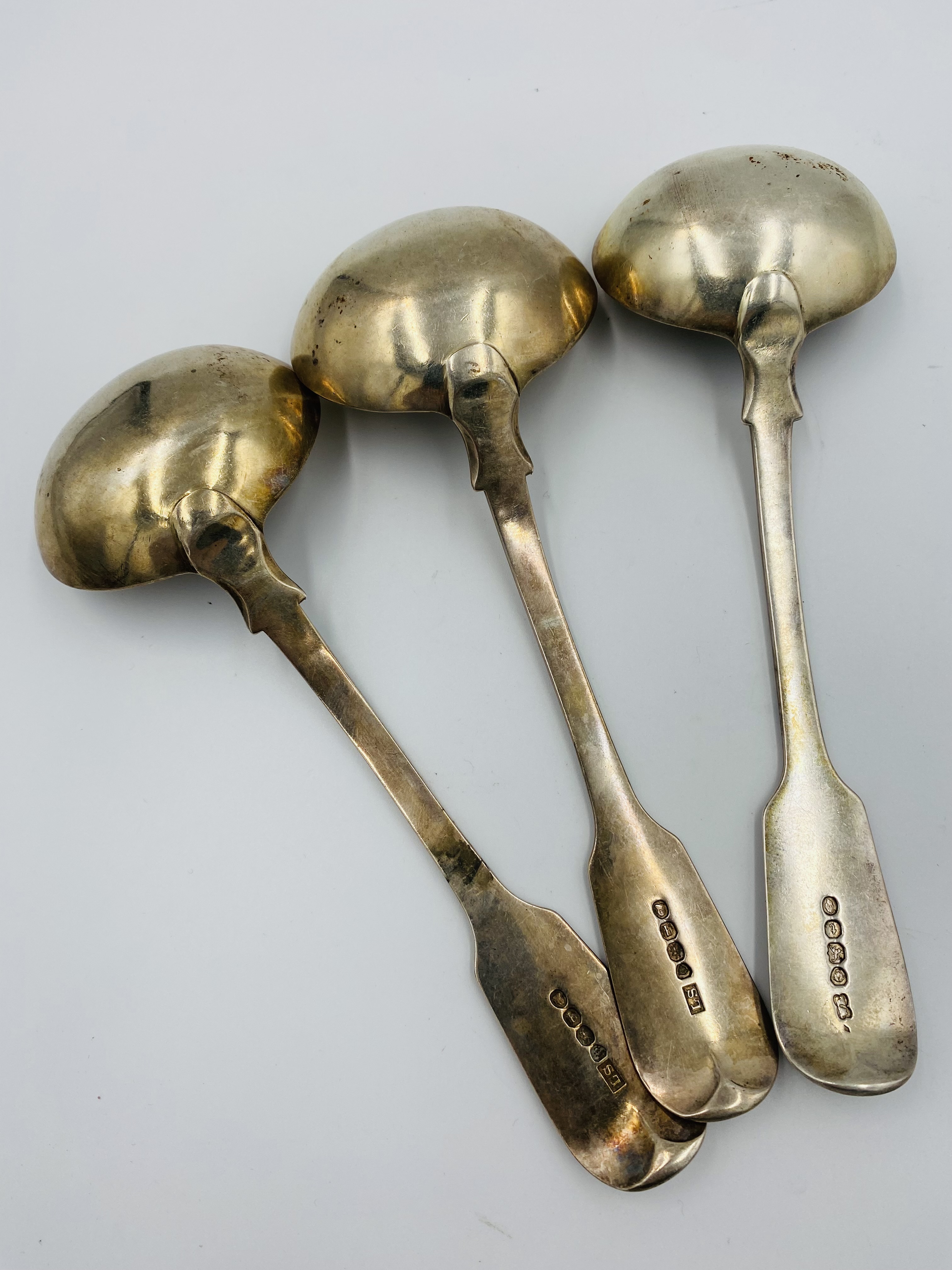 A pair of silver sauce ladles together with a silver sauce ladle - Image 2 of 2