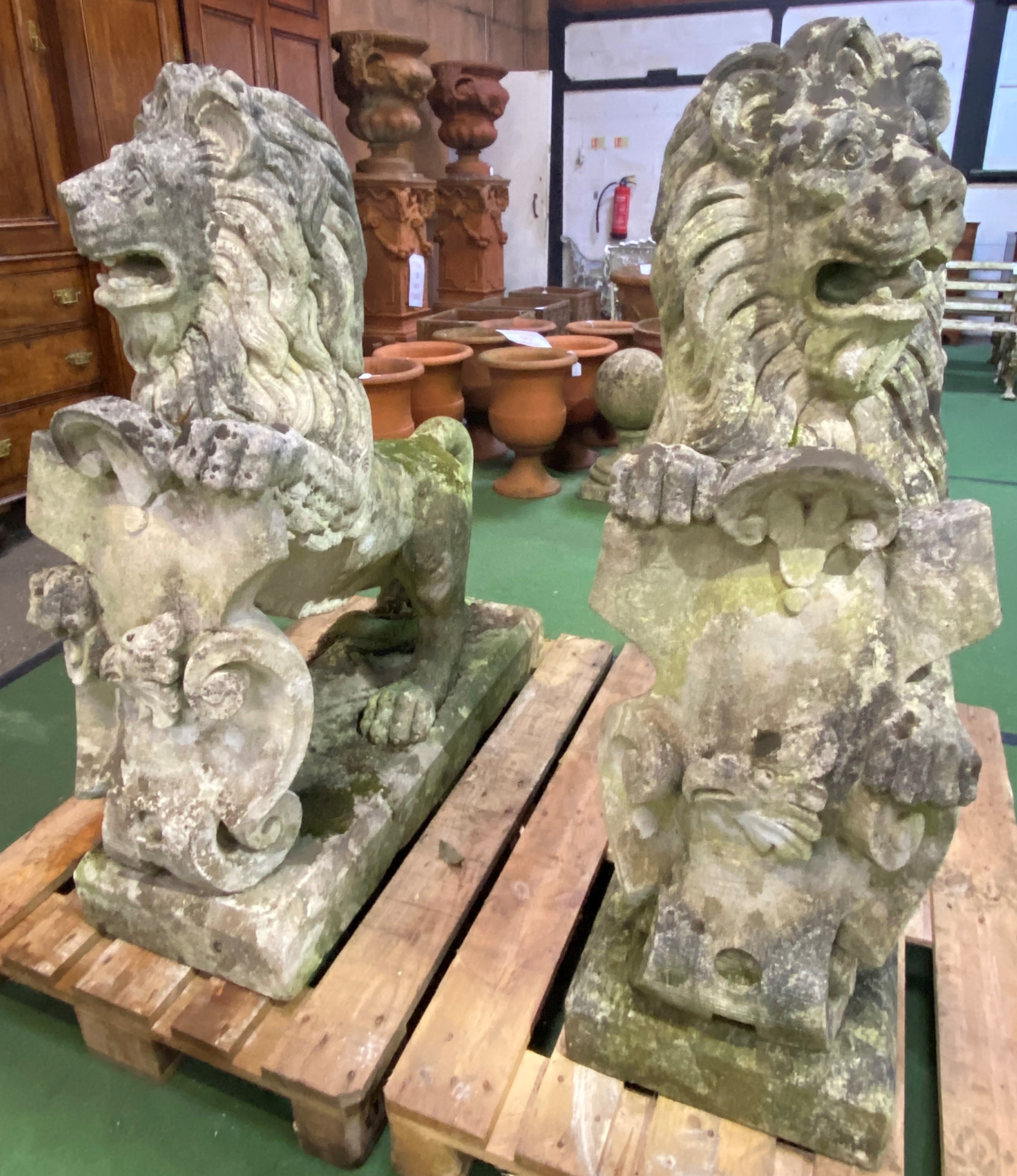 Pair of cast stone rearing lions. From the Estate of Dame Mary Quant