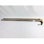 Silver tipped cane together with a cane with yellow metal ferrule