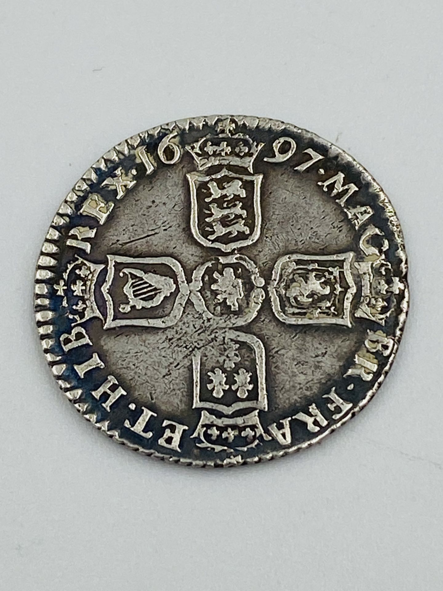 William III 1697 silver sixpence; together with two other coins - Image 2 of 5