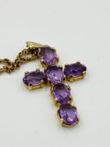 9ct gold cross set with amethysts, on a 9ct gold rope chain