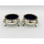 A pair of silver cruet bowls together with a silver filigree bonbon dish