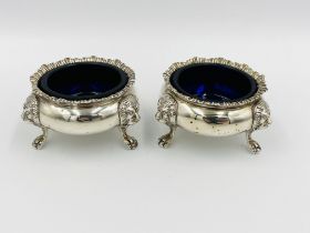 A pair of silver cruet bowls together with a silver filigree bonbon dish