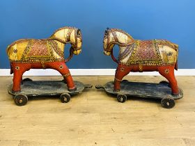 Two Middle Eastern wood horses on wheels. From the Estate of Dame Mary Quant