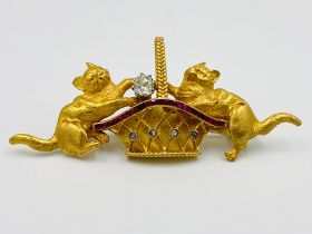 18ct gold cat brooch set with rubies and solitaire diamond