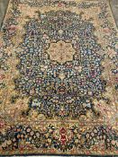 Blue ground rug with floral decoration