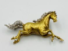 Yellow metal brooch