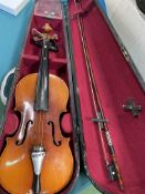 Three violins in hard cases