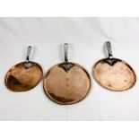 Three Victorian copper saucepan lids with steel handles