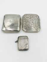 Two silver cigarette cases together with a silver vesta case