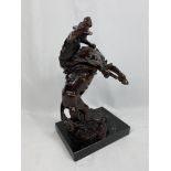 Bronzed figurine of a rodeo rider, signed to base