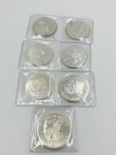 Six Canadian silver coins together with a USA silver coin