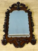 Carved mahogany mirror