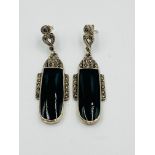 A pair of Art Deco style silver, marcasite, and green cabochon drop earrings