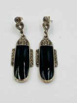 A pair of Art Deco style silver, marcasite, and green cabochon drop earrings
