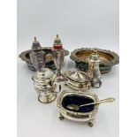 Two silver plate cruets, together with a pair of silver plate bottle coasters