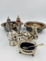 Two silver plate cruets, together with a pair of silver plate bottle coasters