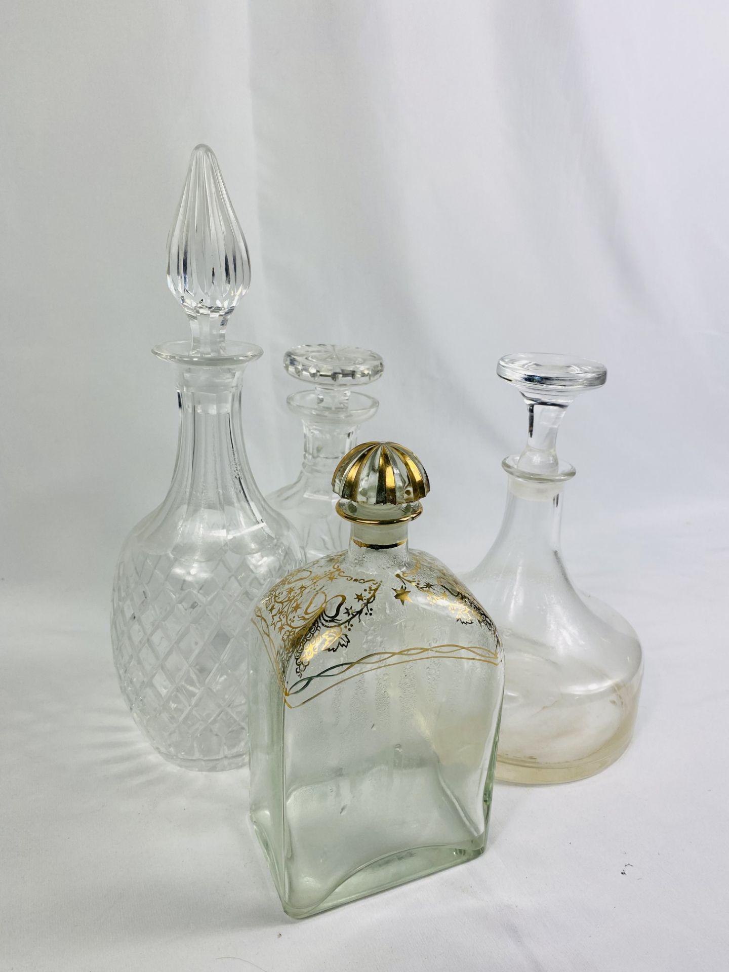 Four glass decanters