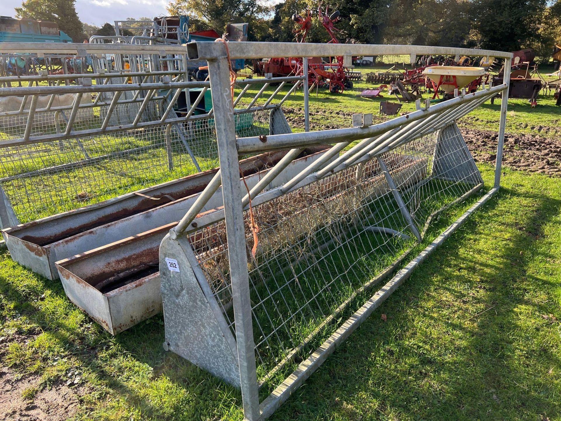 Cattle feed barrier and trough