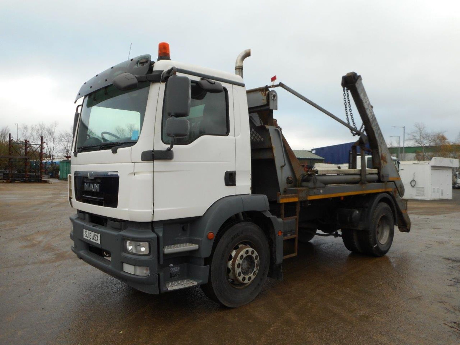 MAN TGM 18.250 4X2 BB with a HUVA LIFT HG Skip Loader and HYVA Auto Sheet