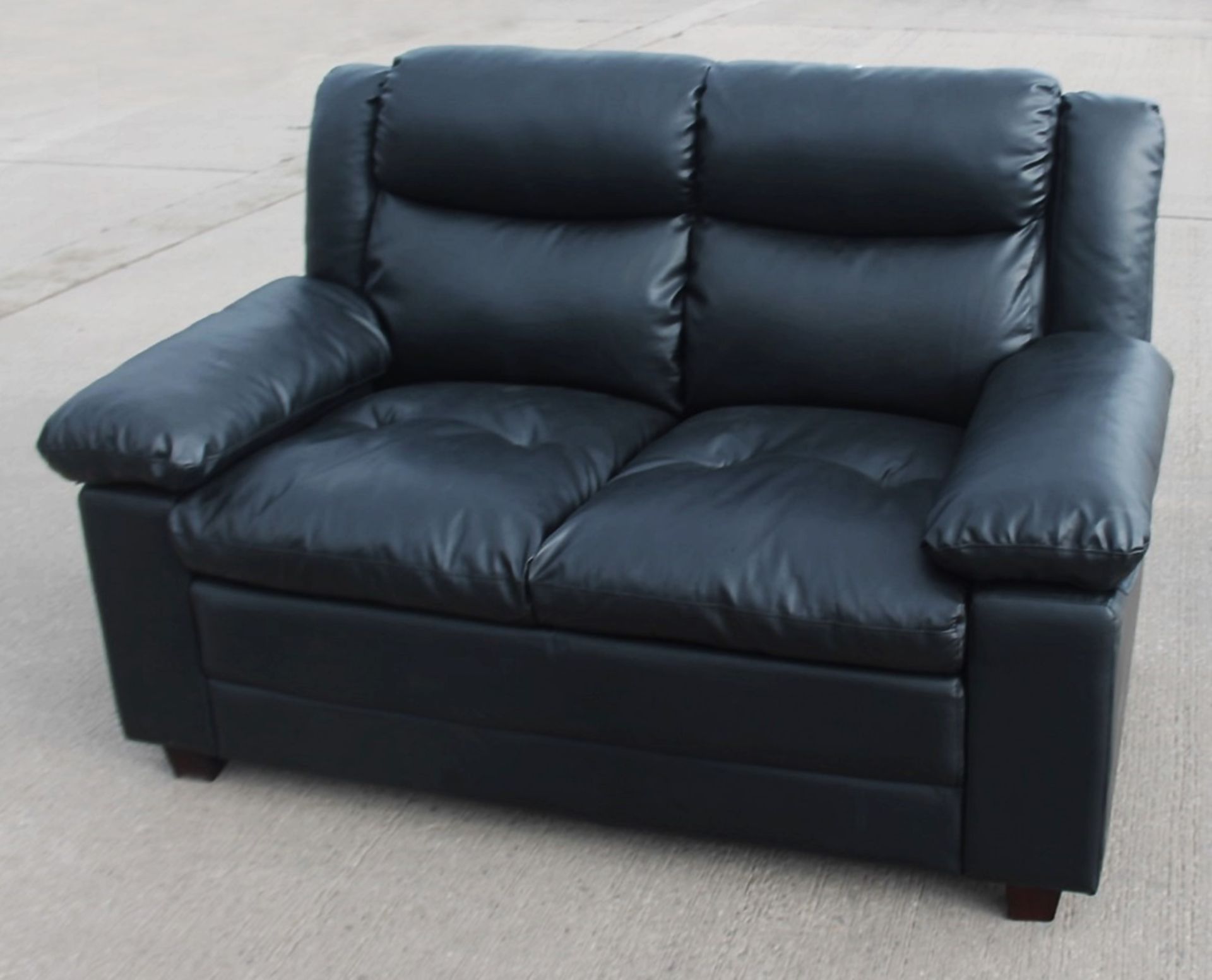 1 x 2-Seater Sofa, Upholstered In A Premium Black Faux Leather - From An Exclusive Property - NO VAT
