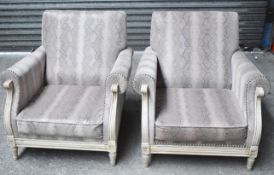 A Pair Of Bespoke Armchairs With A Matching Foot-stool, All Featuring Carved Frames, And Upholstered