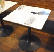 3 x Square Dining Tables With Black Tulip Bases and White Laminate Tops With Cow Print Stickers