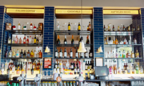 1 x Selection of Back Bar Items to Include 3 x Signs, 3 x Metal Bottle Racks With Glass Shelves