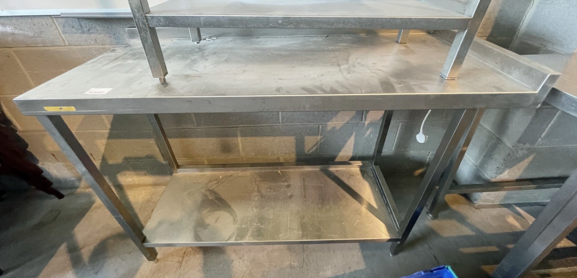 1 x Stainless Steel Prep Table With Corner Upstand and Undershelf - Dimensions: H92 x W130 x D53 cms