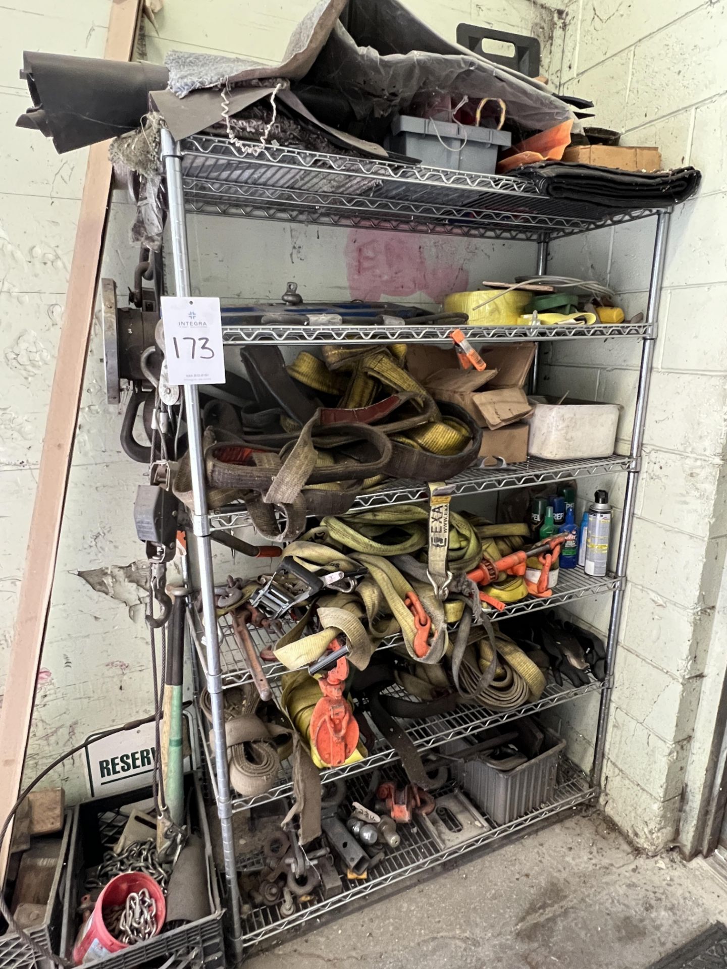 Rack with Assorted Used Lifting and Strapping Items