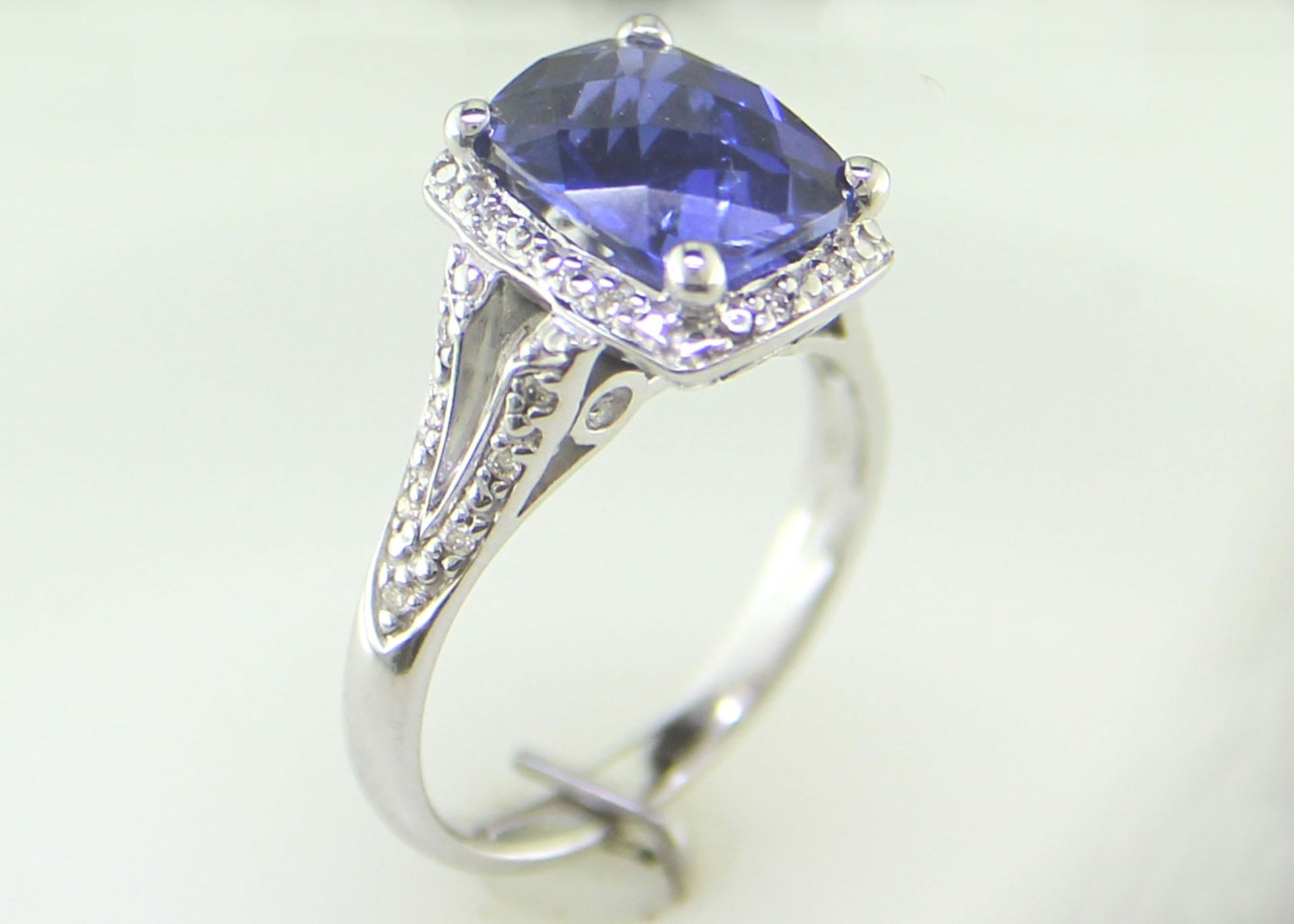 9ct White Gold Cushion Cluster Diamond And Created Ceylon Sapphire Ring - Valued By IDI £3,395. - Image 7 of 10