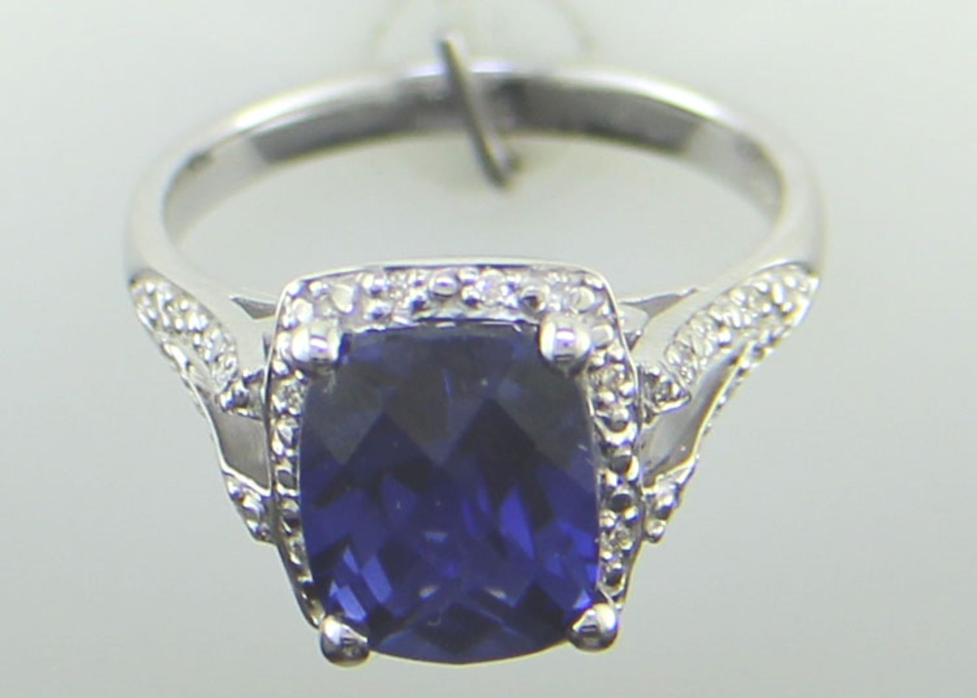 9ct White Gold Cushion Cluster Diamond And Created Ceylon Sapphire Ring - Valued By IDI £3,395. - Image 8 of 10