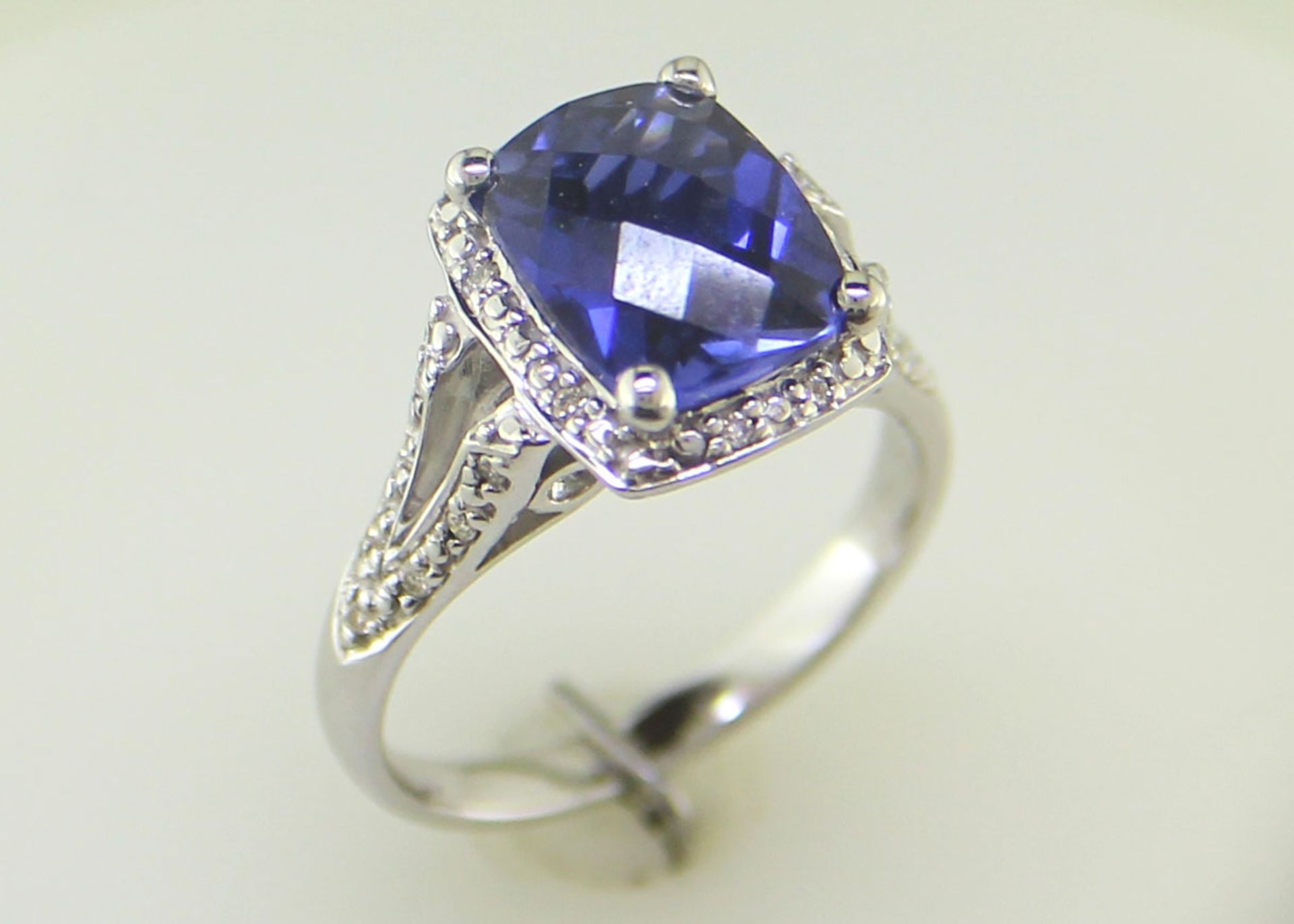 9ct White Gold Cushion Cluster Diamond And Created Ceylon Sapphire Ring - Valued By IDI £3,395. - Image 6 of 10