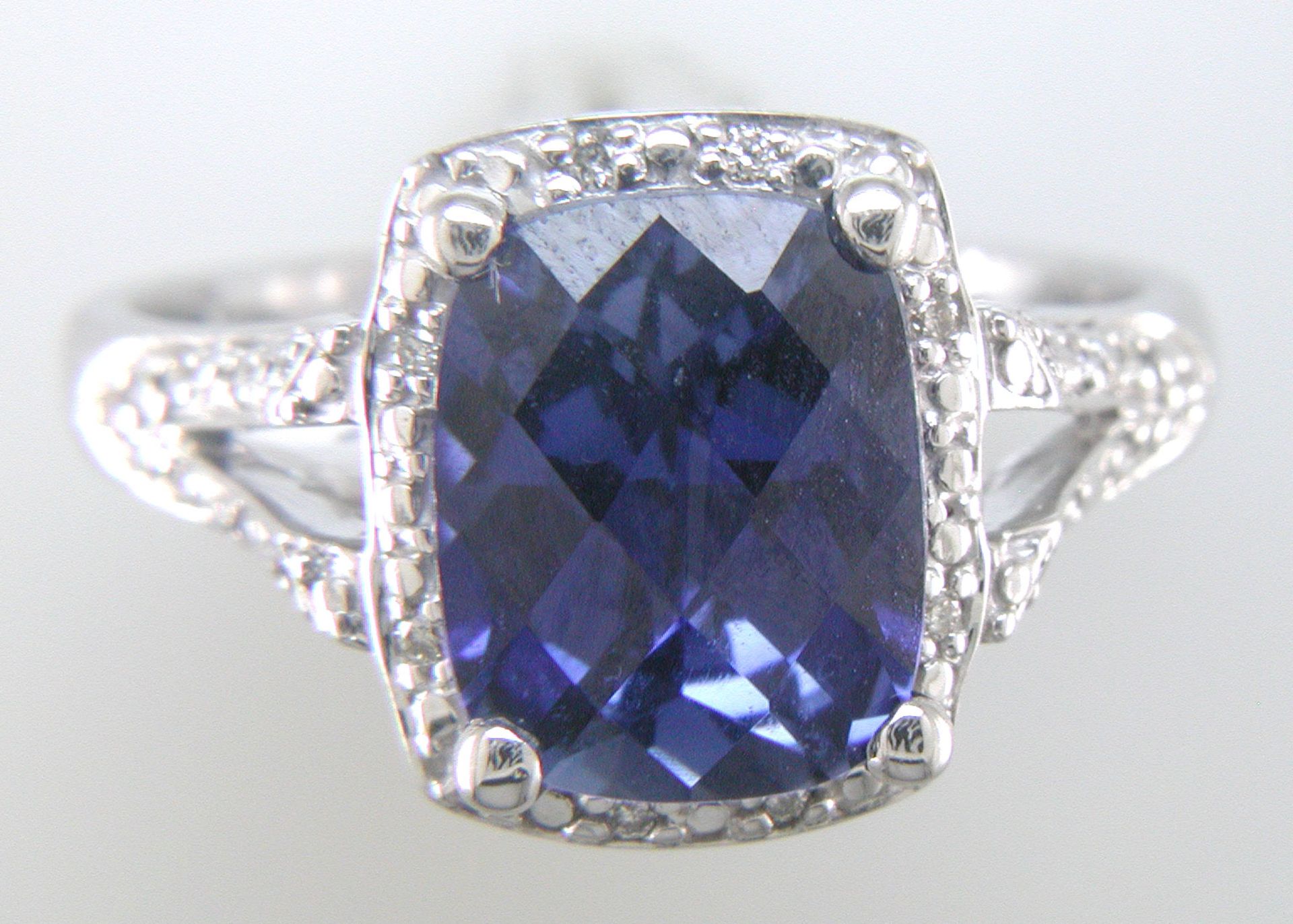 9ct White Gold Cushion Cluster Diamond And Created Ceylon Sapphire Ring - Valued By IDI £3,395. - Image 9 of 10