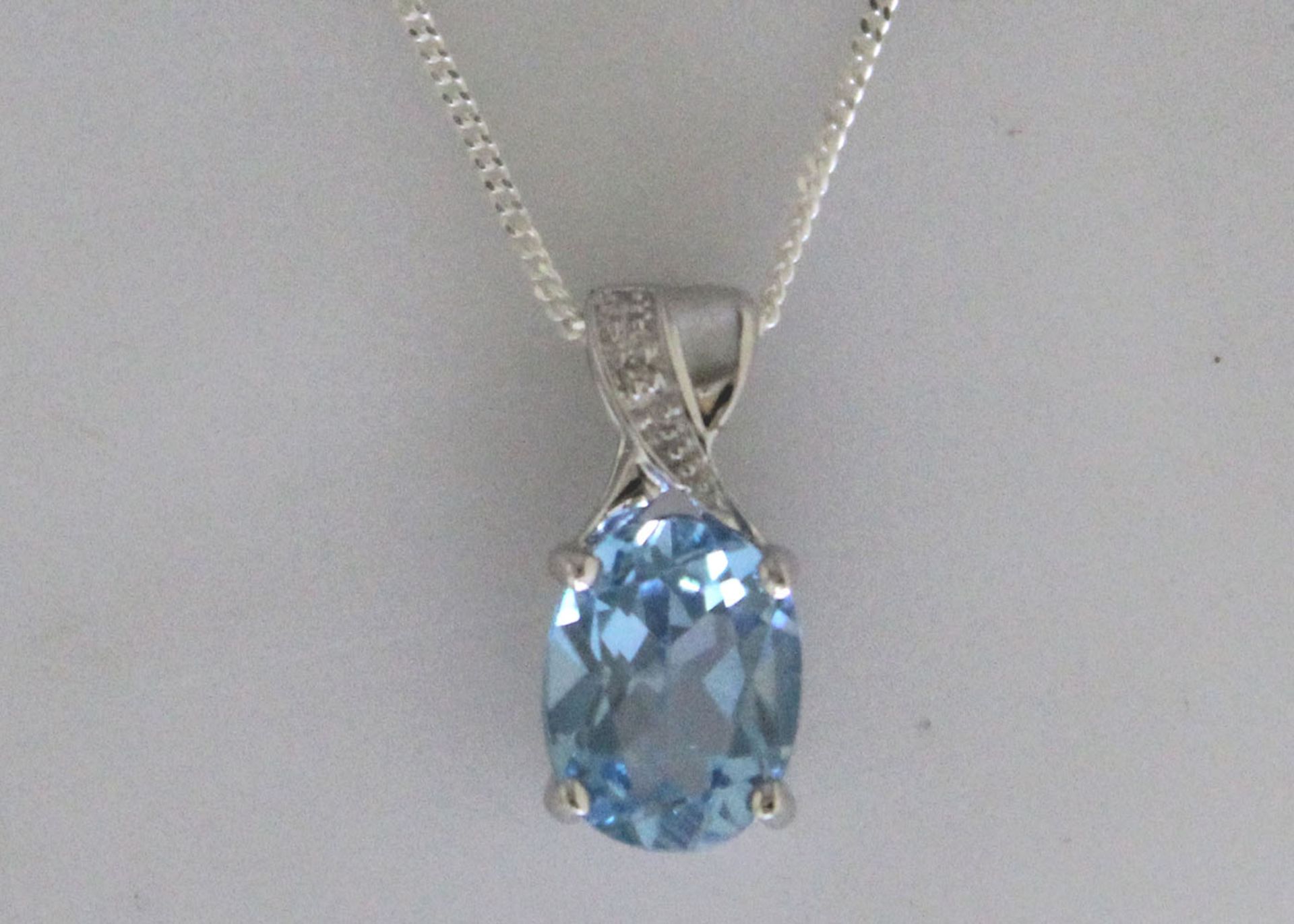 9ct White Gold Diamond And Blue Topaz Pendant (BT2.00) 0.01 Carats - Valued By GIE £680.00 - An oval - Image 8 of 9