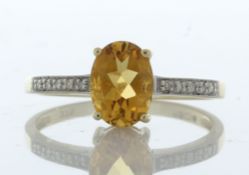 9ct Yellow Gold Diamond And Citrine Ring (C1.09) 0.04 Carats - Valued By IDI £1,370.00 - An oval 8mm