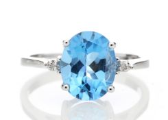 9ct White Gold Diamond And Blue Topaz Ring 0.01 Carats - Valued By IDI £1,465.00 - An oval cut