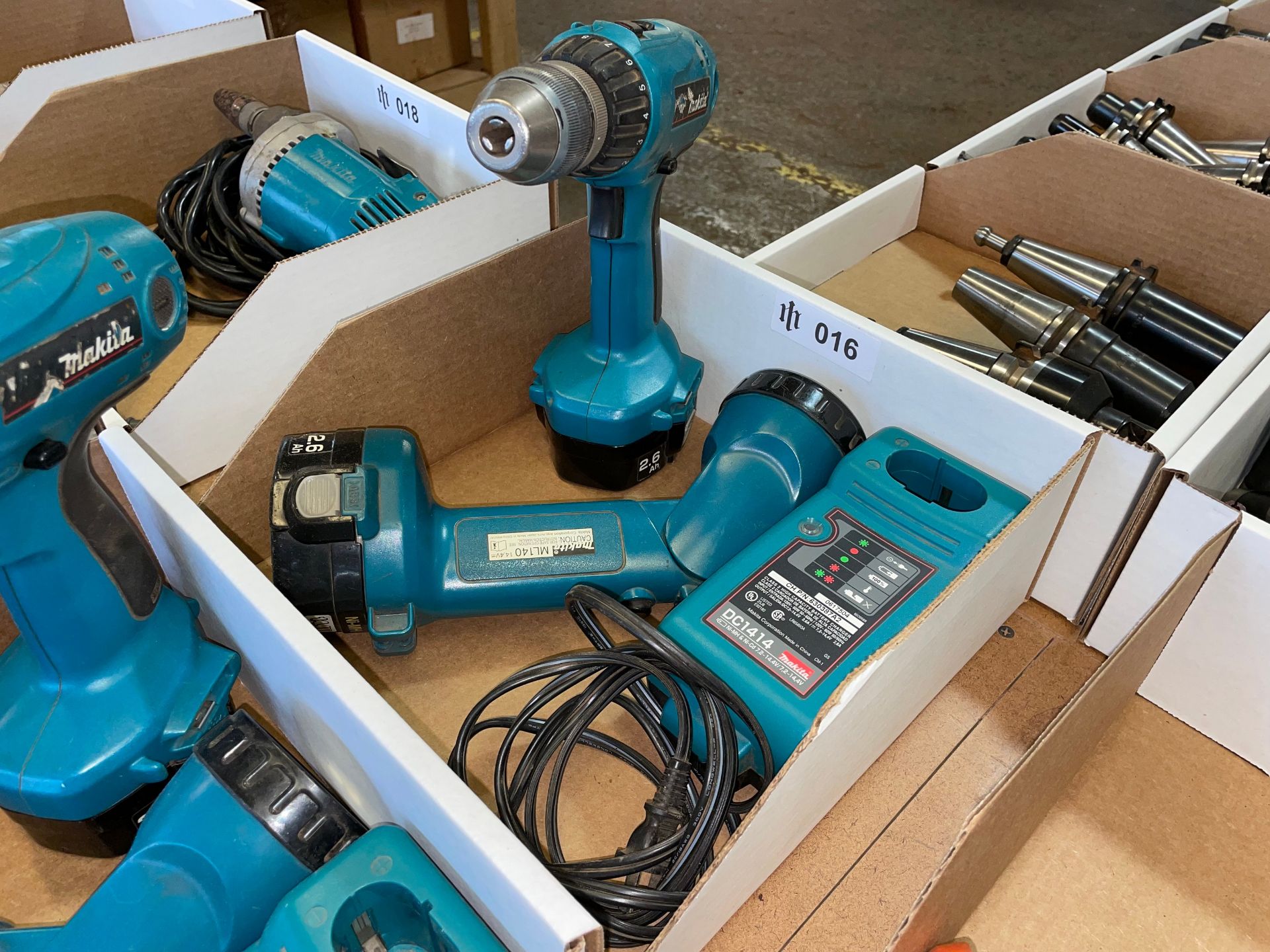 Lot including a Makita Drill, Light and Charger