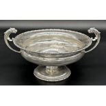 Early 20th century silver twin handed pedestal dish, with mythical beast handles, maker mark worn,
