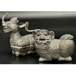 Far Eastern silver character betel nut boxes in the form of a dragon and dog of foo, 12 & 9cm long