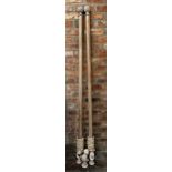 Pair of good limed wood curtain poles, with floral finials, with rings and brackets, 183cm long